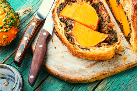 Roll stuffed with pumpkin and mushrooms. Pumpkin baked in a bread loaf.の写真素材