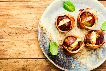 Figs wrapped in fried bacon stuffed with cheese.Copy spaceの写真素材