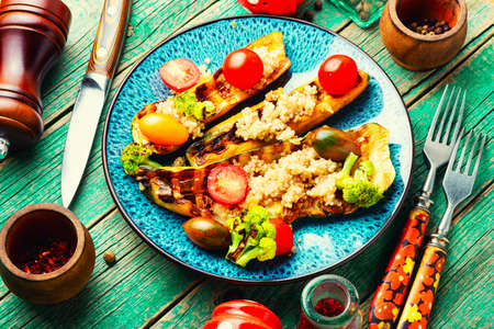 Vegetable food with grilled zucchini,broccoli,tomato and quinoa.Vegan foodの写真素材