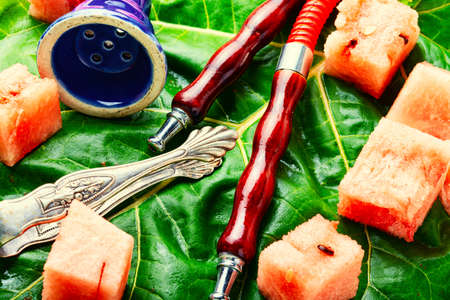 Tasty smoking hookah with watermelon flavored tobacco.Arabic shisha for relaxationの写真素材