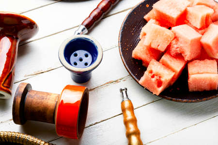 Tasty oriental hookah with watermelon flavored tobacco.Shisha for relaxation