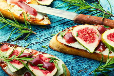 Bruschetta with figs, curd cheese and rosemary.Small sandwiches