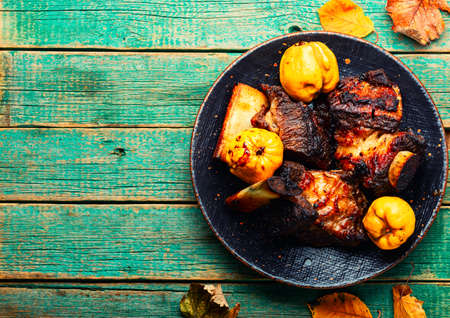 Appetizing beef ribs fried with autumn quince.Space for textの写真素材