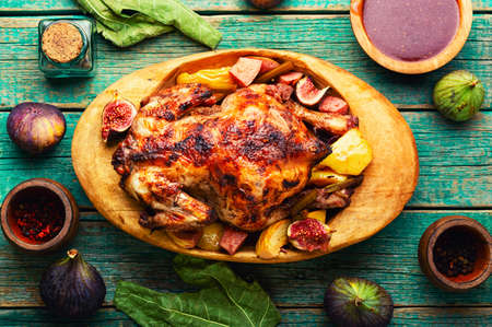 Homemade chicken baked with figs. Autumn recipeの写真素材