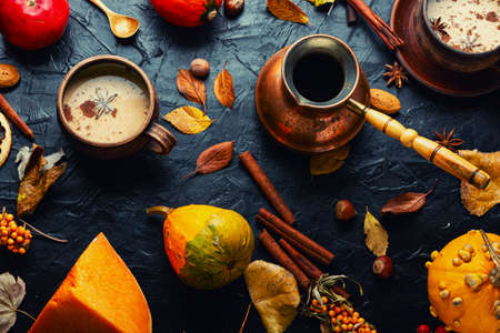 Pumpkin latte or coffee on an autumn backgroundの写真素材