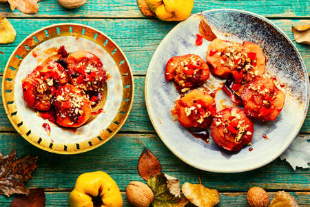 Dessert of caramelized quince with nuts and candied fruits. Eastern sweetsの写真素材