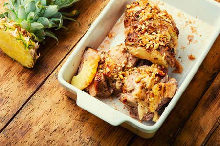 Delicious piece of pork roasted with cheese and pineappleの写真素材