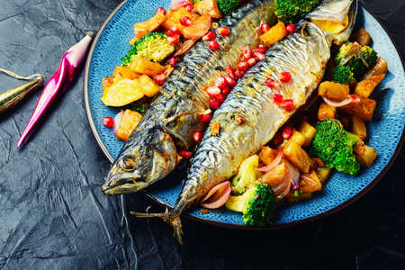 Tasty baked mackerel fish with pineapple and broccoli. Grilled fishの写真素材