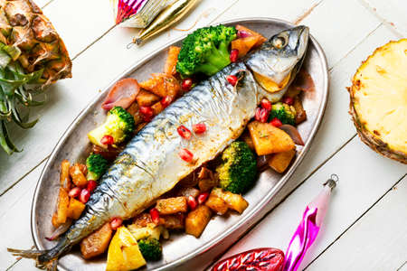 Roasted mackerel fish with pineapple for Christmas table. Seafoodの写真素材