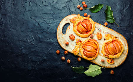 Autumn homemade apple pie.Seasonal mini pie.Space for textの写真素材