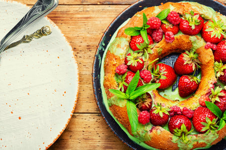 Delicious pie with summer berries. Cupcake with raspberries and strawberriesの写真素材