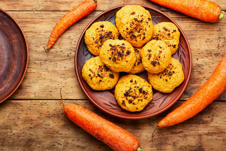 Vegetarian homemade carrot biscuits. Carrot cookies on wooden surfaceの写真素材