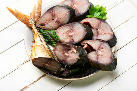 Fragrant tuna mackerel smoked in spices. Pieces of salted scomber