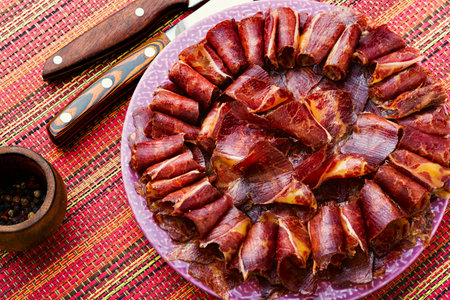 Sliced basturma or meat jerky.Beef jerky,dried beef on plate.Armenian foodの写真素材