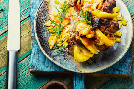 Delicious grilled meat with mango and cheese.の写真素材