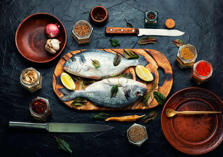 Fresh fish, dorado and spices. Raw dorado, or sea carp.の写真素材