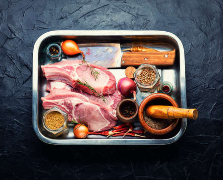 Fresh, raw pork loin on the bone. Uncooked meatの写真素材