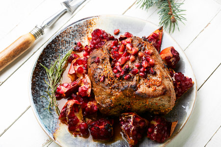 Delicious piece of meat fried with pomegranate.の写真素材