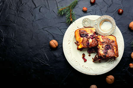 Piece of cake with chocolate, cherries and nuts. Marble cake. Copy spaceの写真素材