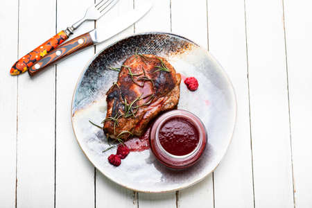 Delicious fried pork with raspberry sauce, barbecueの写真素材