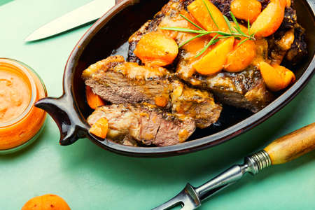 Appetizing beef entrecote in apricot sauce.BBQ steakの写真素材