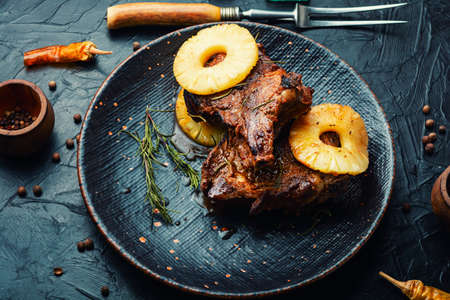 Grilled beef entrecote with pineapple on the plateの写真素材