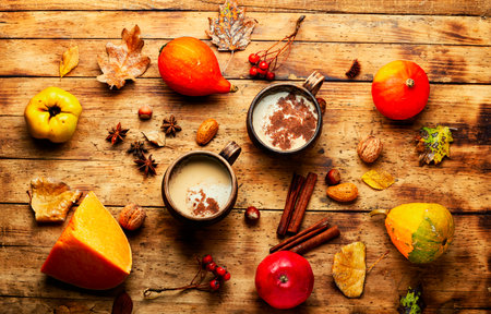 Pumpkin latte or coffee on an autumn backgroundの写真素材
