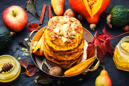 Delicious fritter on the table. Tasty pancakes with fruits.の写真素材