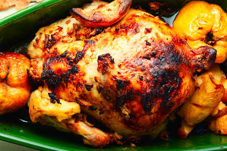 Fragrant partridge or chicken roasted with apples and quince.Poultry meatの写真素材