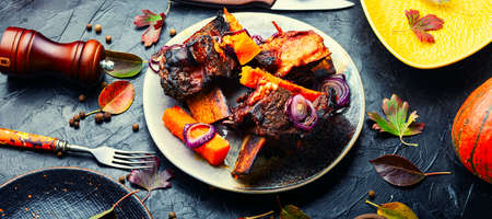 Baked beef ribs with pumpkin.Roasted veal meat with slices of pumpkinの写真素材