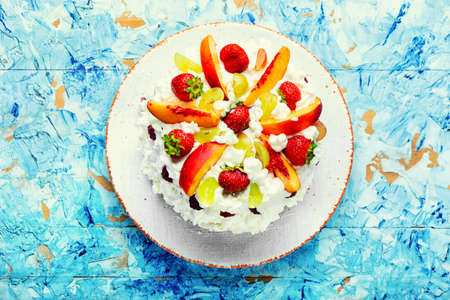 Delicious summer watermelon pie with fruit and whipped cream.