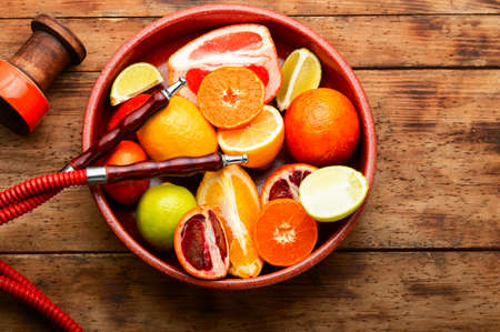 East smoking kalian or shisha with tobacco from citrus fruits.