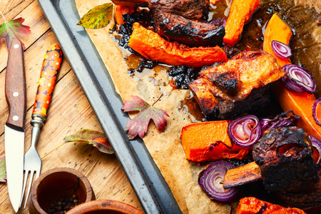 Baked beef ribs with pumpkin.Roasted veal meat with slices of pumpkinの写真素材