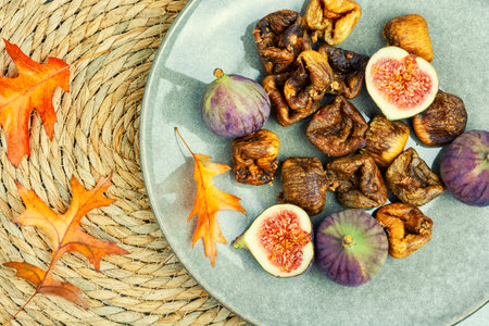 Fig tree fruits, useful dried figs. Dried fruit on the plateの写真素材