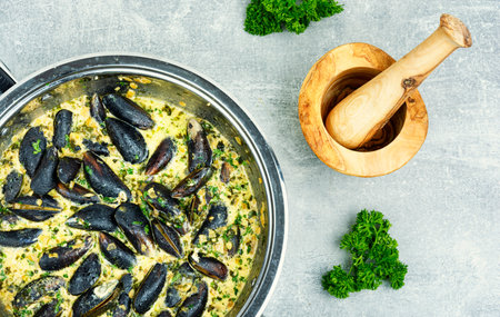 Cooked appetizing mussels in a creamy sauce