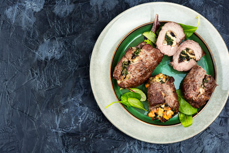 Fried beef meat rolls stuffed with mushrooms and herbs. Top view. Copy spaceの写真素材