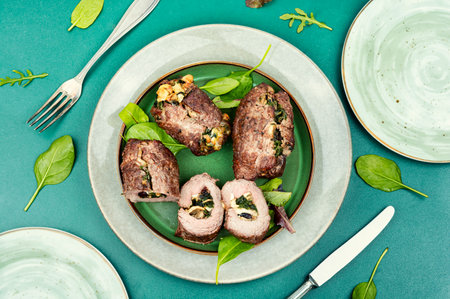 Beef meat rolls stuffed with mushrooms and greens. Homemade baked beefの写真素材