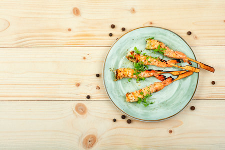 Roasted peeled prawn with skewer. Tasty shrimp barbecue. Copy spaceの写真素材