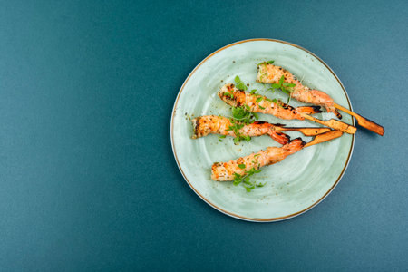 Tasty shrimp barbecue with herbs fried on wooden sticks. Copy spaceの写真素材