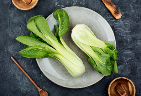Fresh bok choy or chinese cabbage on the kitchen tableの写真素材
