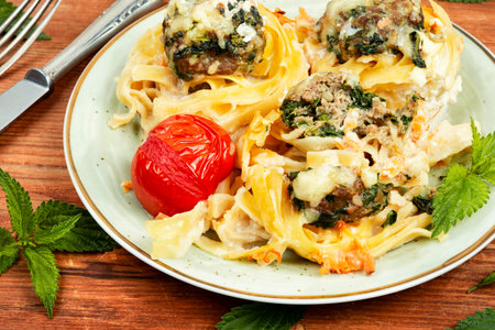Nests of noodles with meatballs and nettles. Keto dish.の写真素材