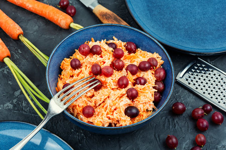 Salad of grated carrots and gooseberries. Healthy diet, veganの写真素材