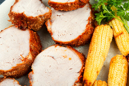 Pork fillet or tenderloin grilled with baked corn. Close upの写真素材