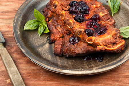 Fried pork ribs with blueberry sauceの写真素材