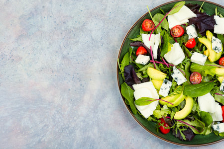 Diet salad of vegetables, herbs and cheese, copy space.の写真素材