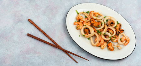 Roasted mussels, squid and shrimp. Seafood plateの写真素材