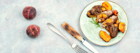 Diet baked beef steak with peach. Space for textの写真素材