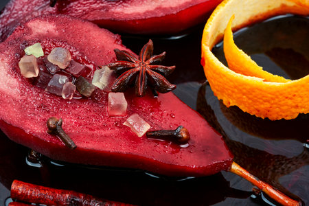 Autumn baked pears in red wine and spices on plate. Food concept.の写真素材