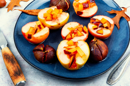 Tasty baked autumn apples and figs, fruit dessert. Fall dishの写真素材