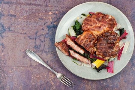 Appetizing roast meat steak with a vegetable garnish. Copy spaceの写真素材